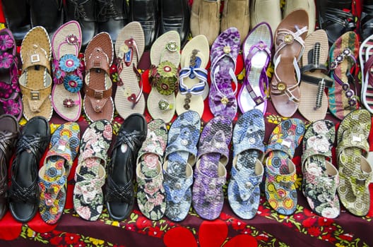 various colorful shoes in India street  market