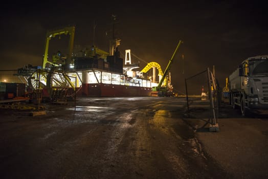 the picture is shot in january 2013 in the evening and shows mv nexans skagerrak which is currently docked at Halden harbor for inspection, maintenance and repairs, the fog was quite tightly and the image got a mysterious touch