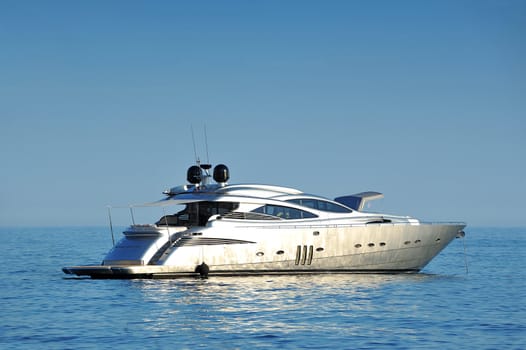 Luxury modern recreational yacht at open sea with copy space.