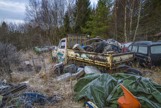 the pictures are shot in january 2013 and shows different car wreck on a scrapyard for cars somewhere in sweden