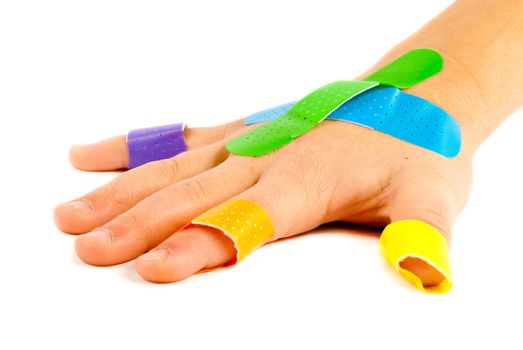 Colorful bandages on child's hand.