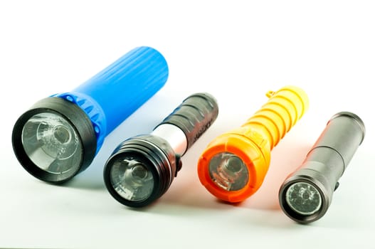 Four different styles of flashlights.  Isolated on white.