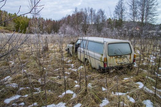 the pictures are shot in January 2013 and shows different car wreck on a scrapyard for cars somewhere in sweden