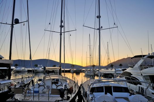 Porto Montenegro marina and the yachts at sunset