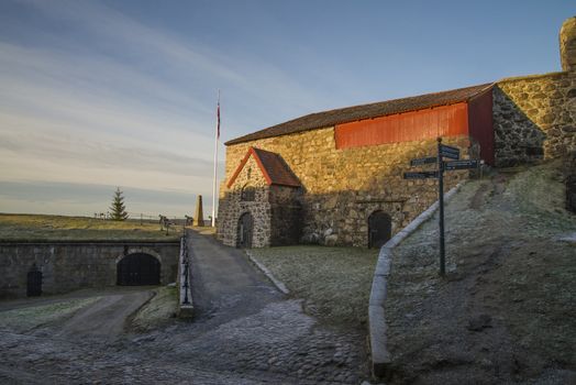 the image is shot in january 2013 at fredriksten fortress in Halden and shows the large powderhouses and western curtain wall that protects the citadel to the west and connects queen's bastion with prince george's bastion, the curtain wall was completed in 1671