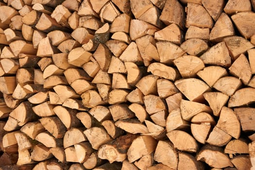 Large number of broken firewood stacked in a pile