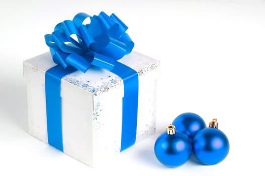 New year gift box isolated on white with Christmas balls, blue