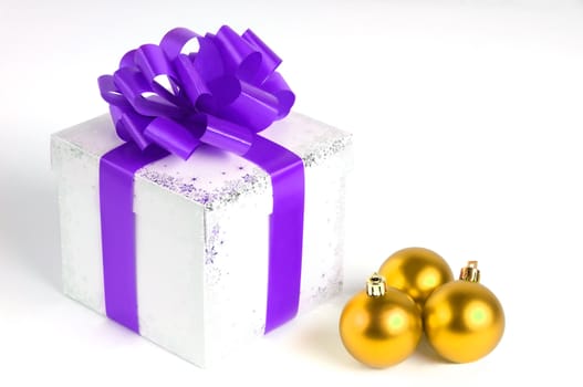 New year gift box isolated on white with Christmas balls, yellow and purple