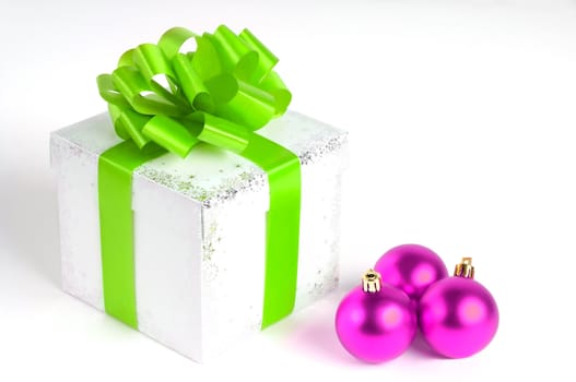 New year gift box isolated on white with Christmas balls, green and purple