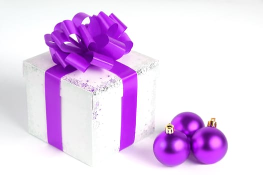 New year gift box isolated on white with Christmas balls, purple