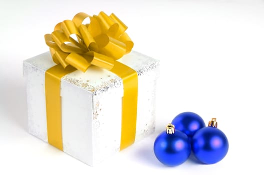 New year gift box isolated on white with Christmas balls, yellow and blue