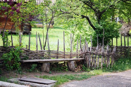 garden bench in rural landscape