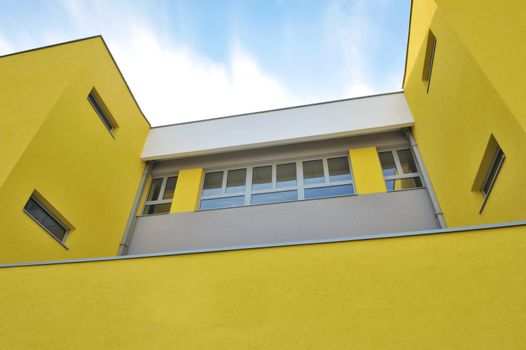 Picture of modern building with sky and clouds