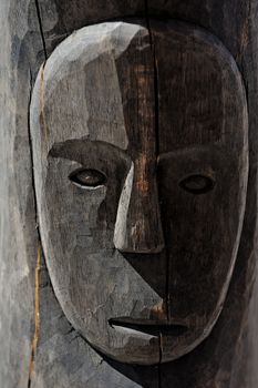 Dark wood with face, handmade art work