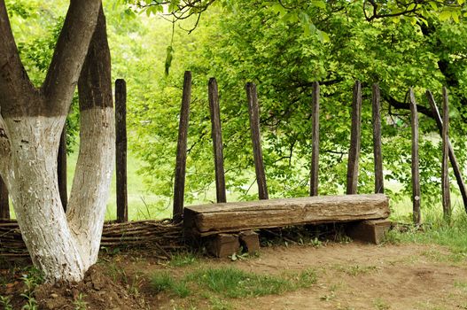 garden bench in rural landscape