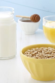 Delicious and nutritious lightly toasted honey, nuts and oats cereal with milk.