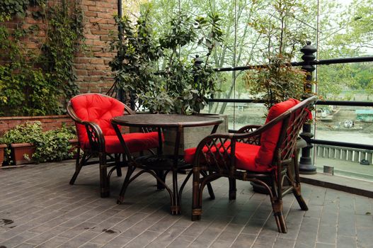Red chairs outdoor with table