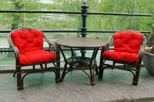 Red chairs outdoor with table