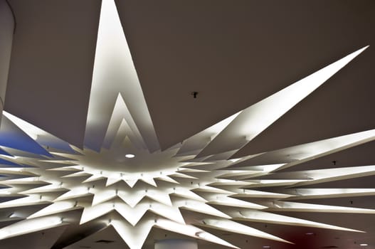 the architecture of the lights on the roof of a shopping mall