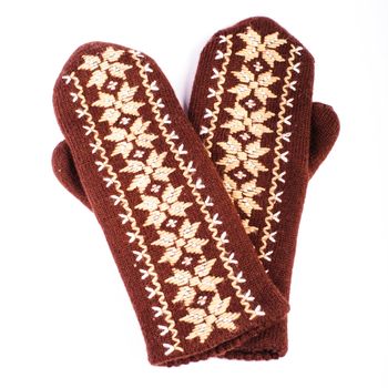 Brown woolen knitted mittens on white background