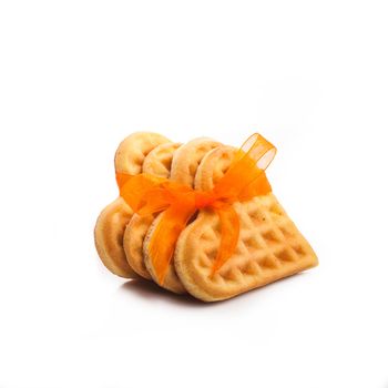 Stack of heart shaped waffles isolated on white background