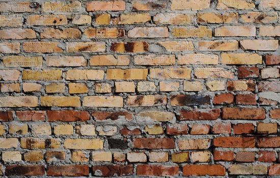 Aged brick wall background. High resolution texture