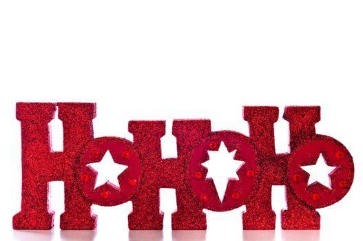 Word spells HoHoHo in red glittery letters; isolated on white background.