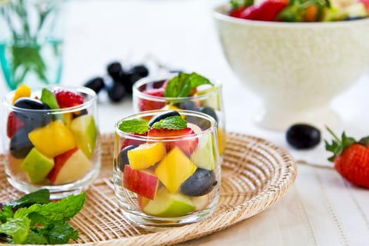 Varieties of fruits salad in small glass