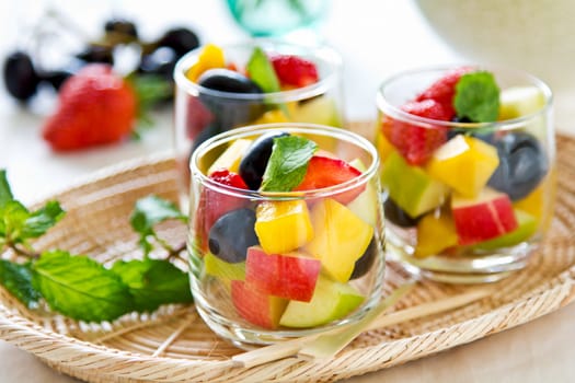 Varieties of fruits salad in small glass