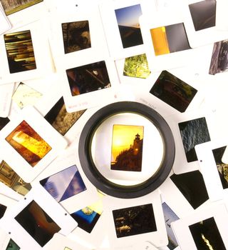 A Pile of Mounted Slide Film Sitting on The Lightbox with Loupe