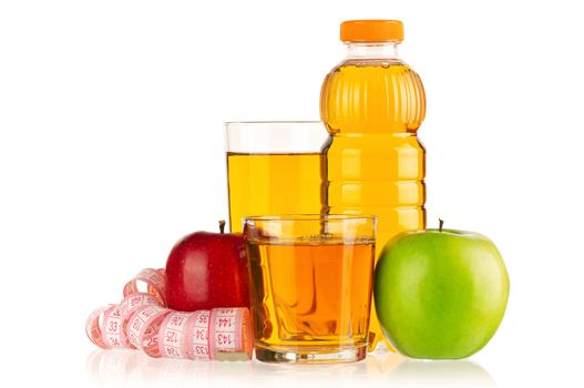 Apple juice in plastic bottle and glass with a measure tape isolated on white background