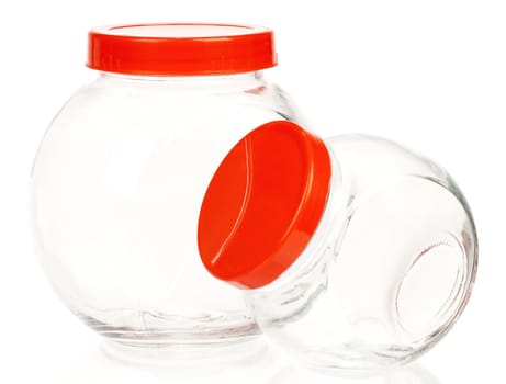 Empty glass jar with red cover isolated on white background