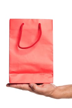Man hand with red shopping bag isolated on white background