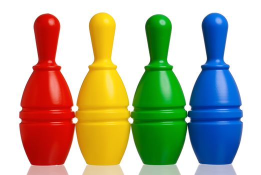 Colorful plastic skittles of toy bowling isolated on a white background