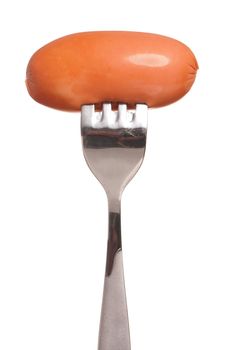 Sausage on fork isolated on white background