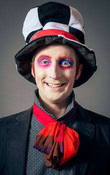 Young man in the image of the Crazy Hatter from "Alice's Adventures in Wonderland" by Lewis Carroll