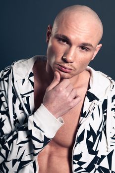 Studio portrait of shirtless muscled bald man