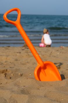 Toy shover at the beach on a sunny day