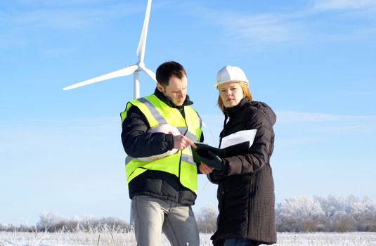 engineers with wind turbines