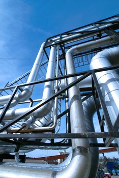 Industrial zone, installation of Steel pipelines and cables in blue tones