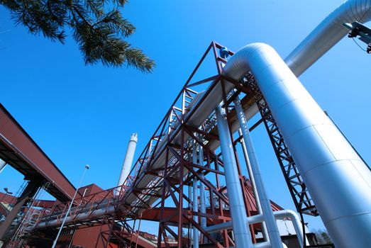 Industrial zone, installation of Steel pipelines and cables in blue tones