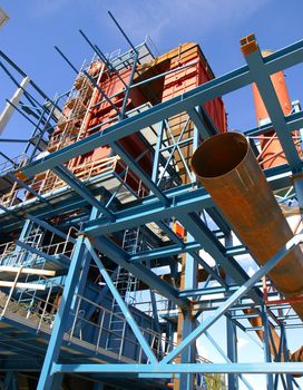 cranes and beams on construction of industrial factory