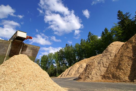 storage of wooden fuel against blue sky