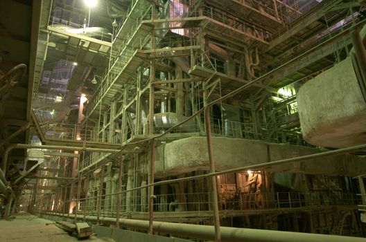 Equipment, cables and piping as found inside of  industrial power plant