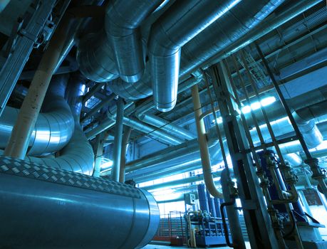 Equipment, cables and piping as found inside of  industrial power plant