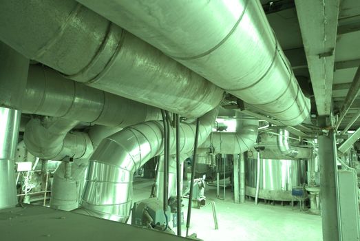 Equipment, cables and piping as found inside of  industrial power plant