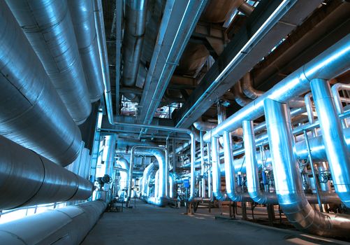 Equipment, cables and piping as found inside of  industrial power plant