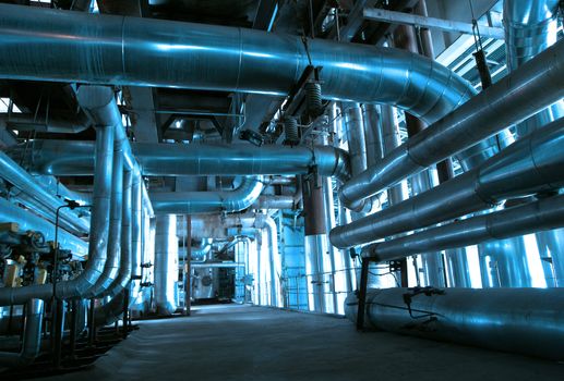 Equipment, cables and piping as found inside of  industrial power plant