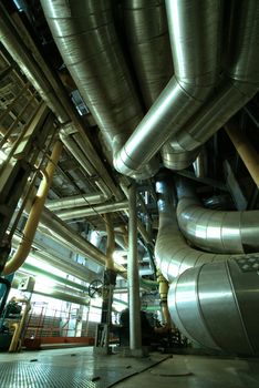 Equipment, cables and piping as found inside of  industrial power plant