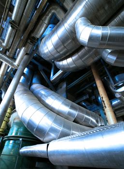 Equipment, cables and piping as found inside of  industrial power plant